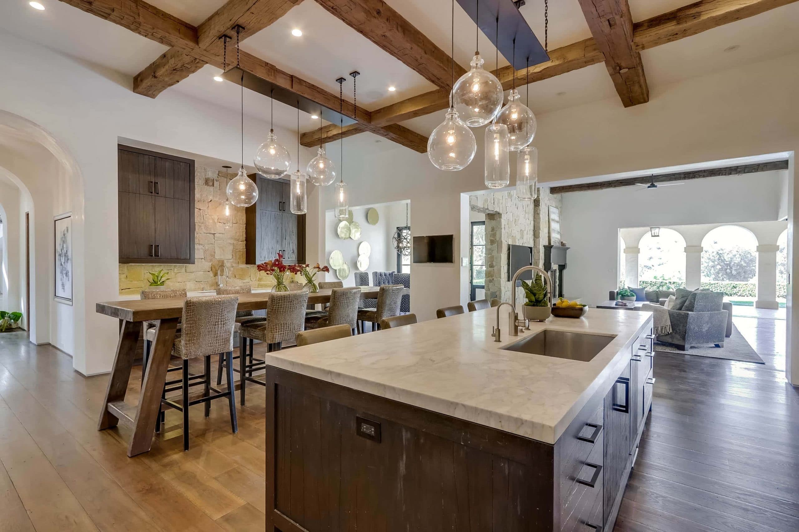 Open Layout Kitchen And Dining Room With Wood Beamed Ceilings And Retractable Walls Of Glass At 22355 Starwood Drive, Yorba Linda