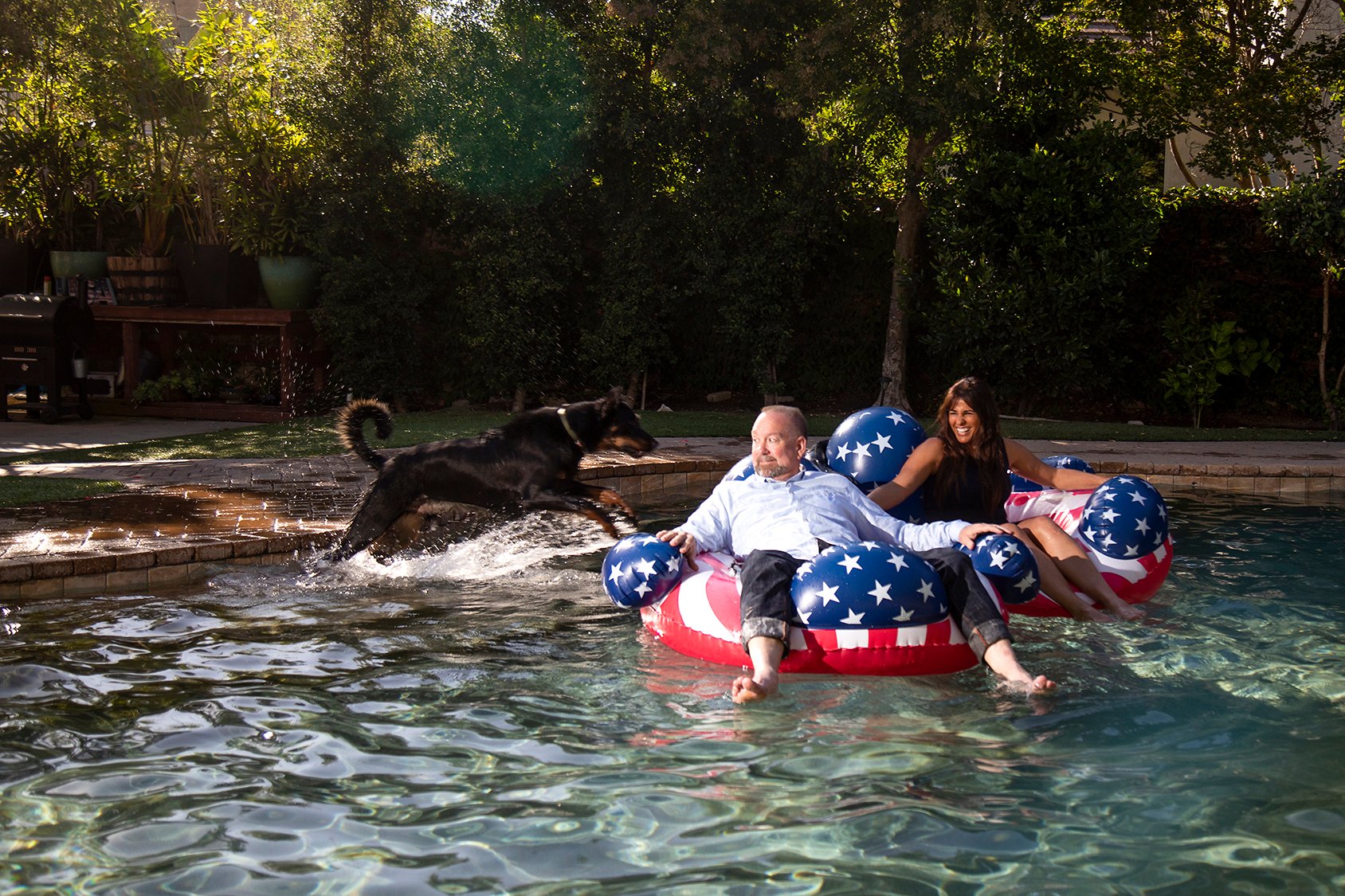 Michele Harrington With Her Husband And Dog In Their Backyard Pool, Playing