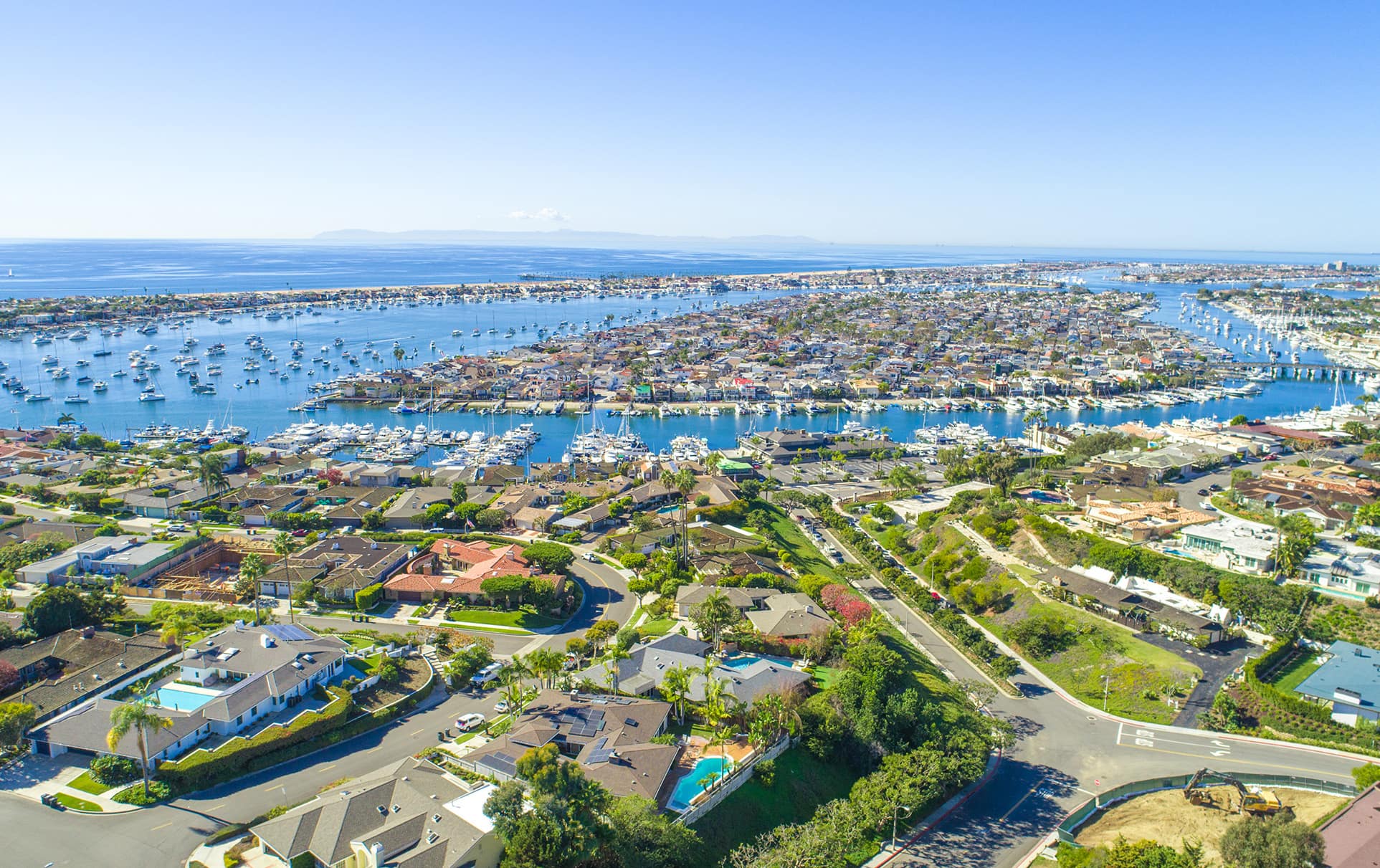 Aerial view of Newport Beach including homes and the harbor