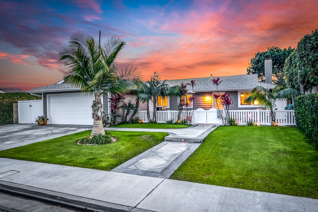 Seal Beach California home exterior with sunset background.