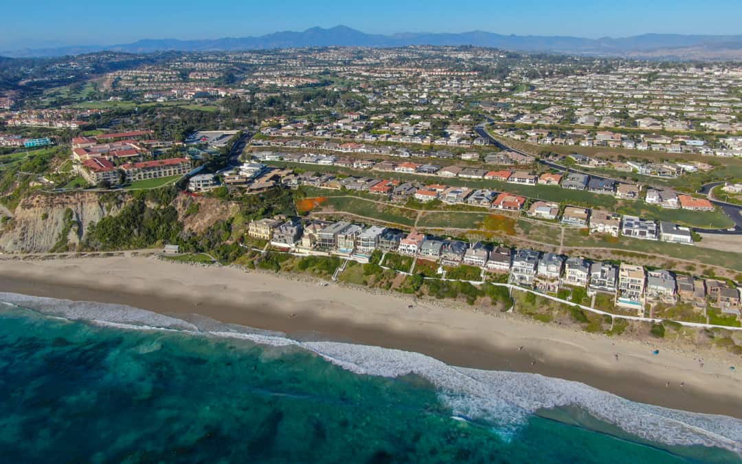 Aerial view of Southern California coastline with ocean and homes