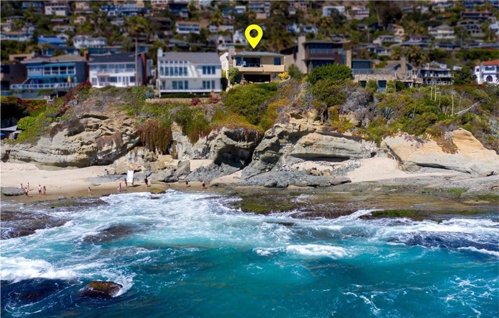 Aerial view of ocean, coastline, and bluff at 11 Camel Point Drive, Laguna Beach